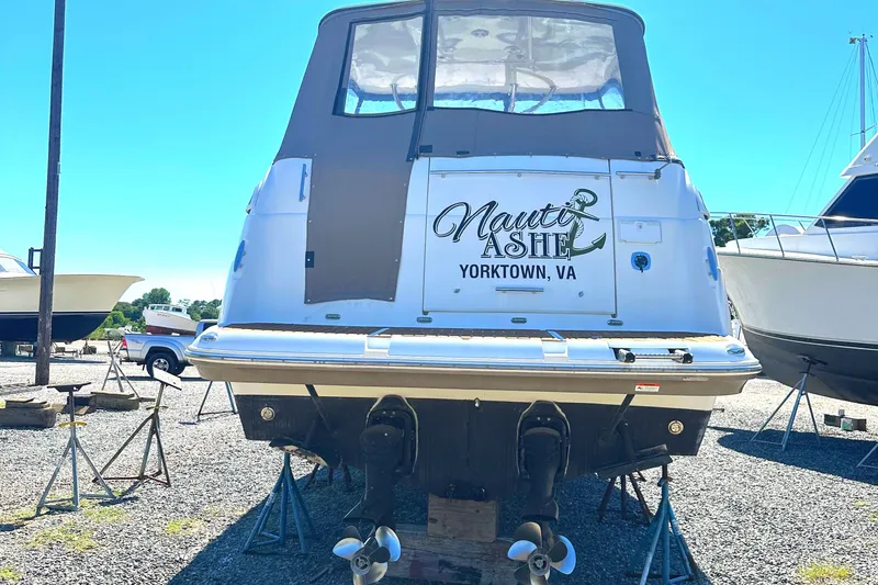 Slide: The Image of 2006 Larson Cabrio 350 boat on stands, Yorktown, VA, with "Nauti & Ashi" text. - 15