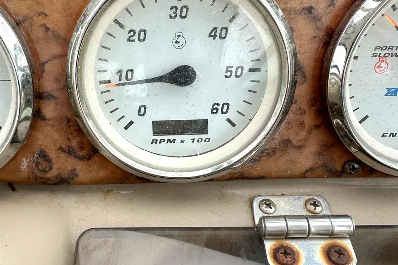 Slide: The Image of Close-up of a 2006 Larson Cabrio 350 tachometer, showing RPM gauge. - 32