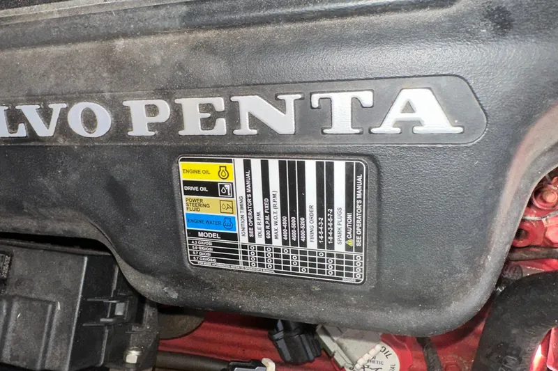 Slide: The Image of Volvo Penta engine label on 2006 Larson Cabrio 350, detailing oil and fluid specifications. - 35