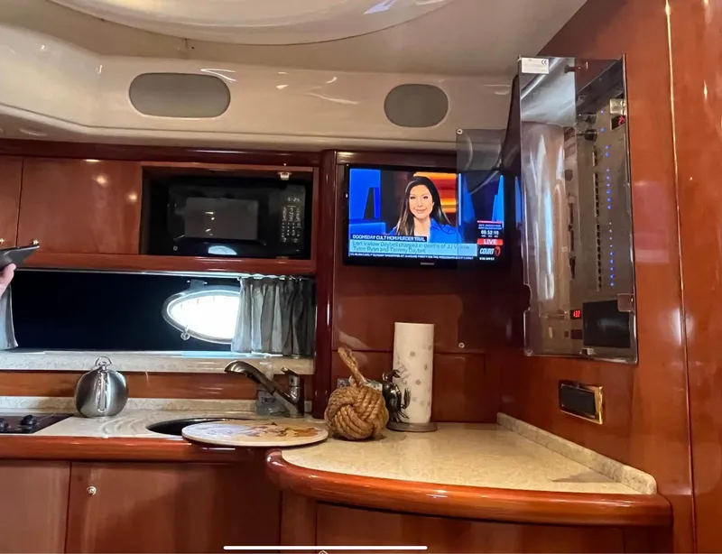 Slide: The Image of Interior of 2003 Cranchi 50 Mediterranne yacht with kitchen and TV. - 14