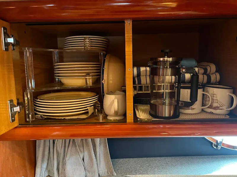 Slide: The Image of Cabinet with dishes and coffee maker on 2003 Cranchi 50 Mediterranne yacht. - 16