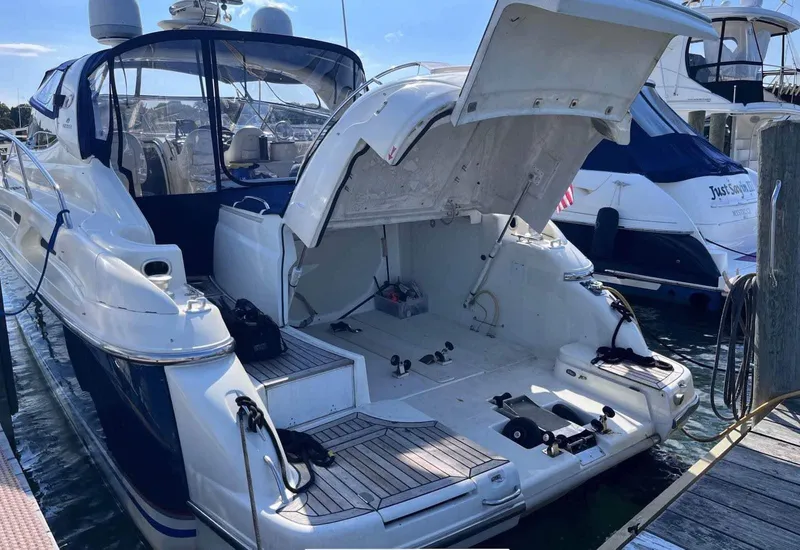 Slide: The Image of 2003 Cranchi 50 Mediterranne yacht with open engine compartment at marina. - 8
