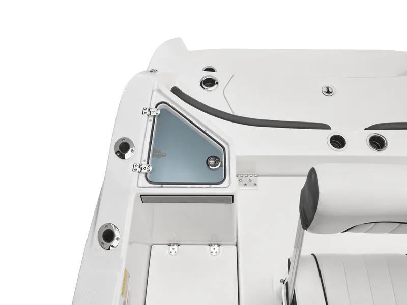 Slide: The Image of 2025 Yamaha Boats 220 FSH Sport interior detail, featuring sleek design and storage compartment. - 10