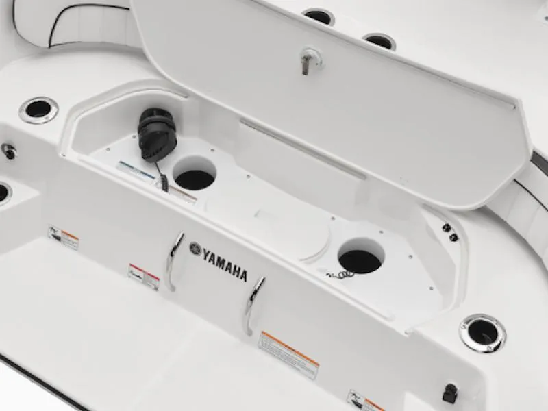 Slide: The Image of 2025 Yamaha Boats 220 FSH Sport interior storage compartment with cup holders. - 6