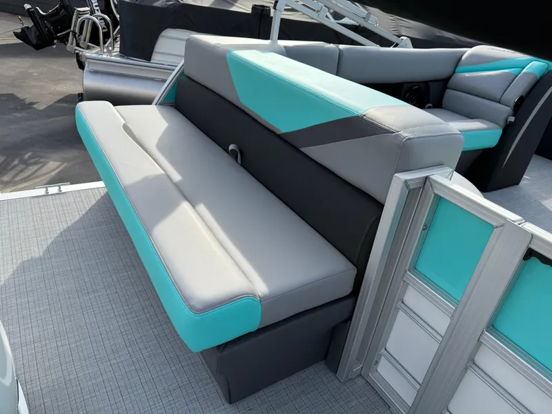 Slide: The Image of 2025 South Bay S222CR2 pontoon boat with teal and gray seating. - 19