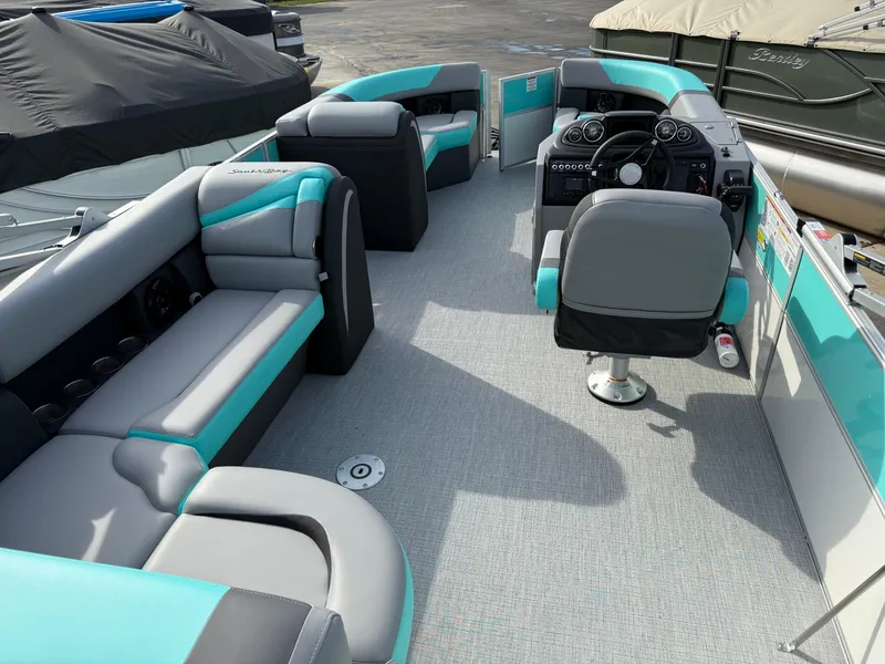 Slide: The Image of 2025 South Bay S222CR2 pontoon boat with spacious seating and modern interior design. - 20