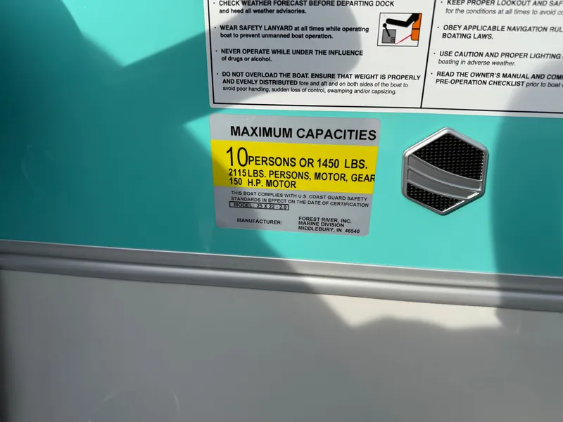 Slide: The Image of 2025 South Bay S222CR2 capacity label: 10 persons, 1450 lbs, 150 HP motor. - 23