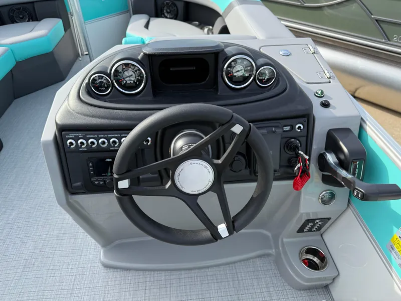 Slide: The Image of 2025 South Bay S222CR2 boat dashboard with steering wheel and control panel. - 8
