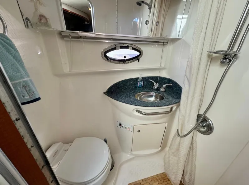 Slide: The Image of 2005 Chaparral Signature 350 bathroom with sink, toilet, and shower. - 10