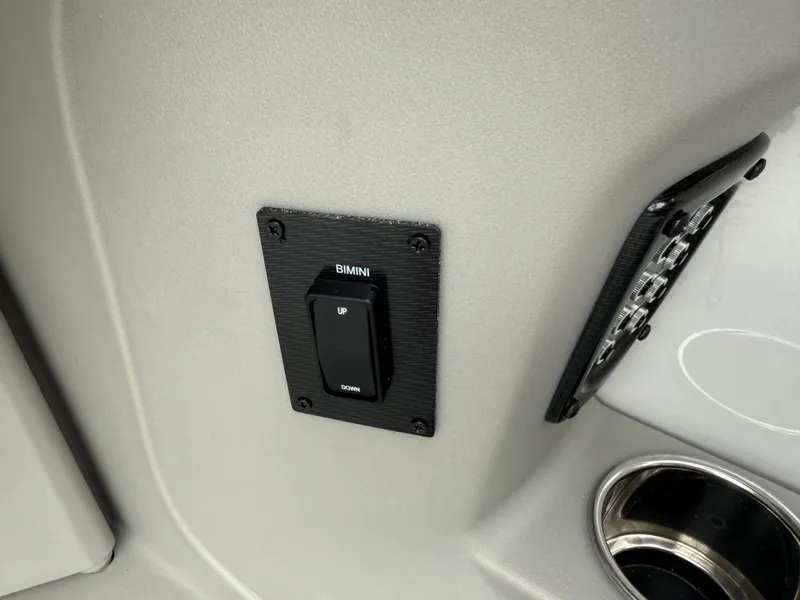 Slide: The Image of Bimini switch on 2025 South Bay 220RS LE boat interior panel. - 12