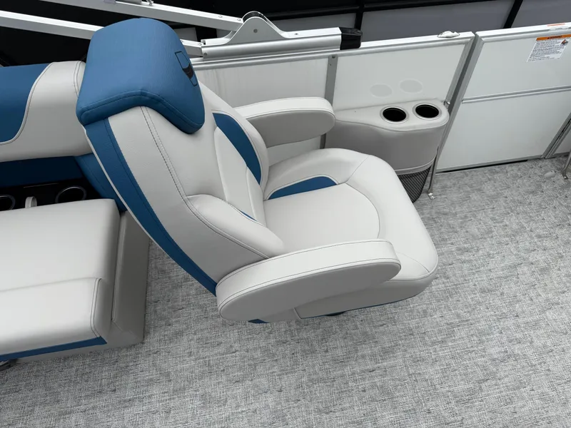 Slide: The Image of Luxury seating on 2025 South Bay 220RS LE boat with cup holders and modern design. - 16