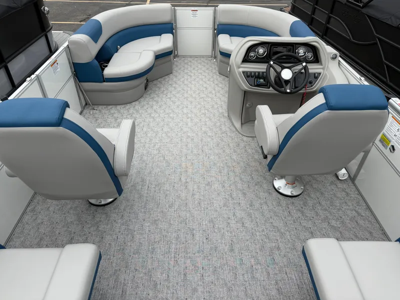 Slide: The Image of 2025 South Bay 220RS LE pontoon boat interior with plush seating and modern helm. - 17
