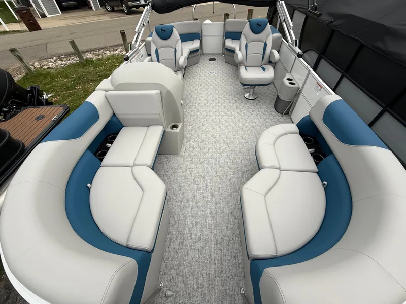 Slide: The Image of 2025 South Bay 220RS LE pontoon boat interior with plush seating and modern design. - 18