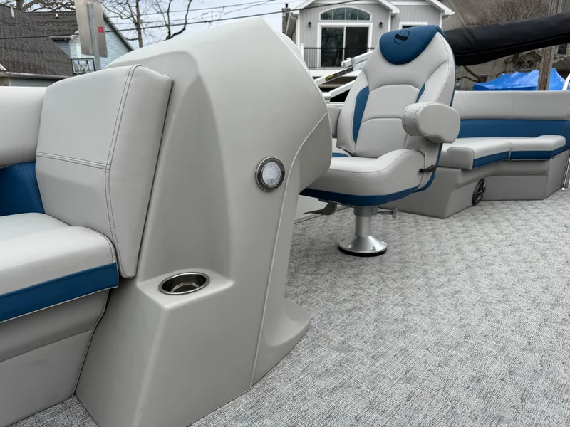 Slide: The Image of 2025 South Bay 220RS LE boat interior with plush seating and modern design. - 2