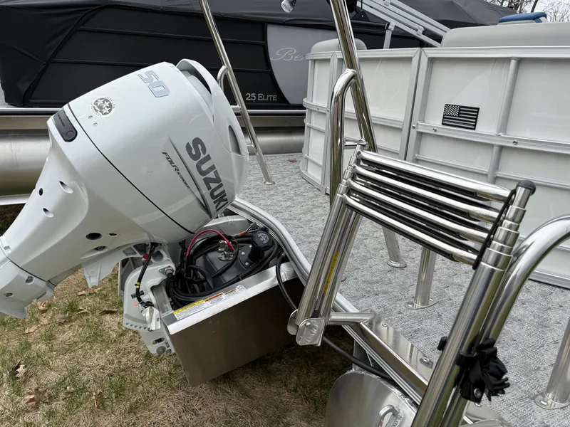 Slide: The Image of 2025 South Bay 220RS LE pontoon boat with Suzuki outboard motor and stainless steel ladder. - 21