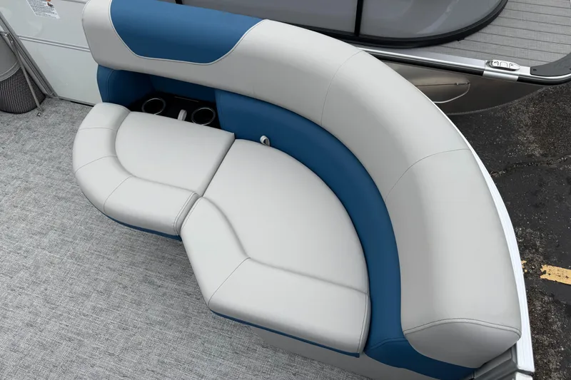 Slide: The Image of Luxurious seating on 2025 South Bay 220RS LE pontoon boat, featuring blue and gray upholstery. - 24