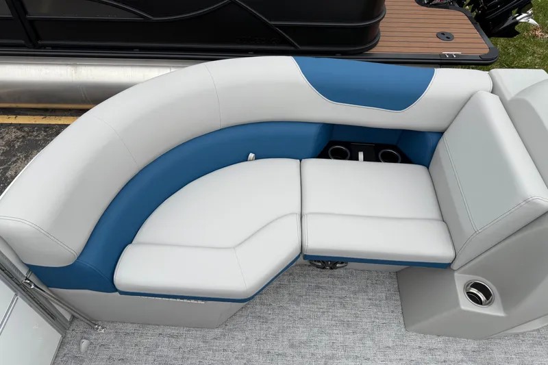 Slide: The Image of Luxurious seating on 2025 South Bay 220RS LE pontoon boat with blue and white upholstery. - 25