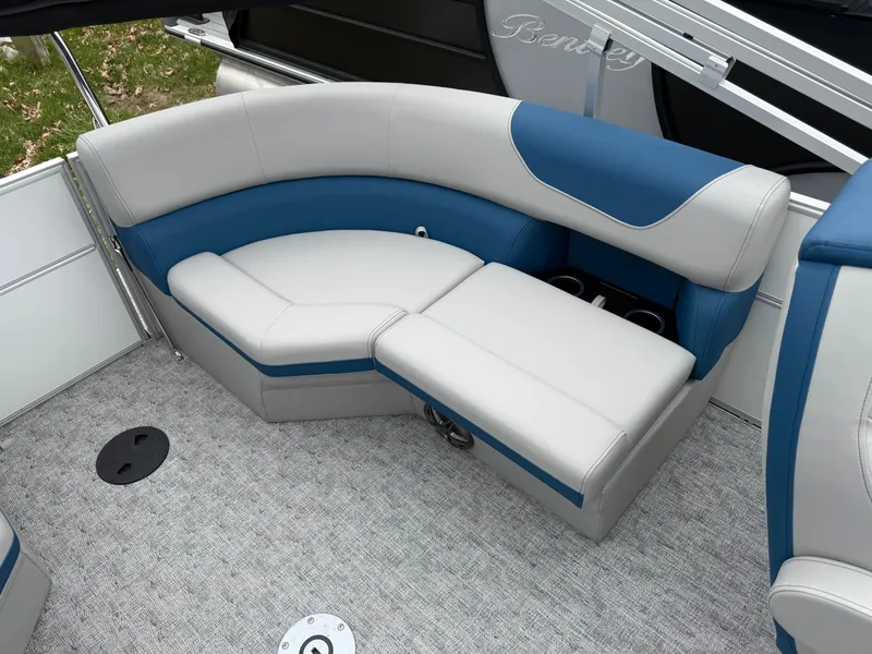 Slide: The Image of 2025 South Bay 220RS LE boat interior with blue and gray seating. - 5