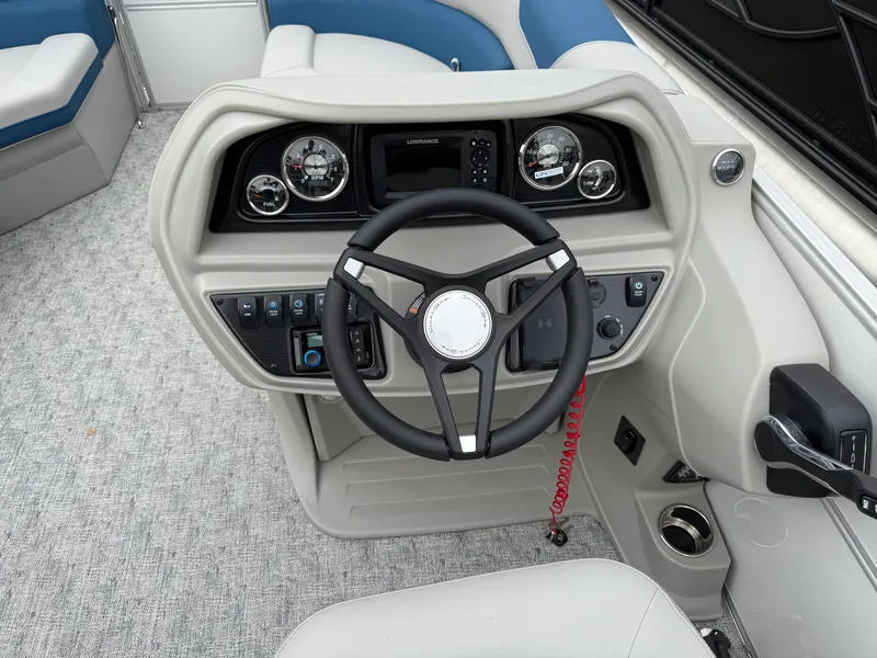 Slide: The Image of 2025 South Bay 220RS LE boat dashboard with steering wheel and control panel. - 8