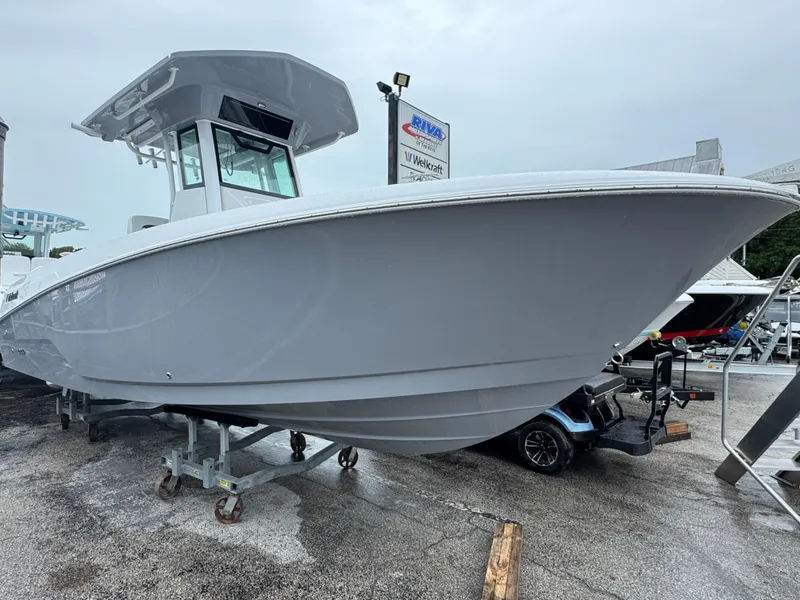 The Image of 2025 Wellcraft 263 Fisherman boat displayed outdoors on a trailer. - 1