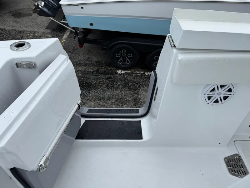 Slide: The Image of 2025 Wellcraft 263 Fisherman boat interior, featuring sleek white design and modern amenities. - 15