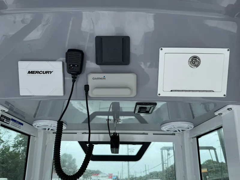 Slide: The Image of 2025 Wellcraft 263 Fisherman boat dashboard with Mercury and Garmin equipment. - 17