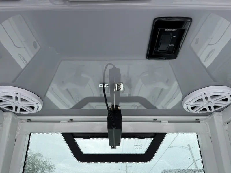 Slide: The Image of 2025 Wellcraft 263 Fisherman boat interior with speakers and electronic controls. - 22