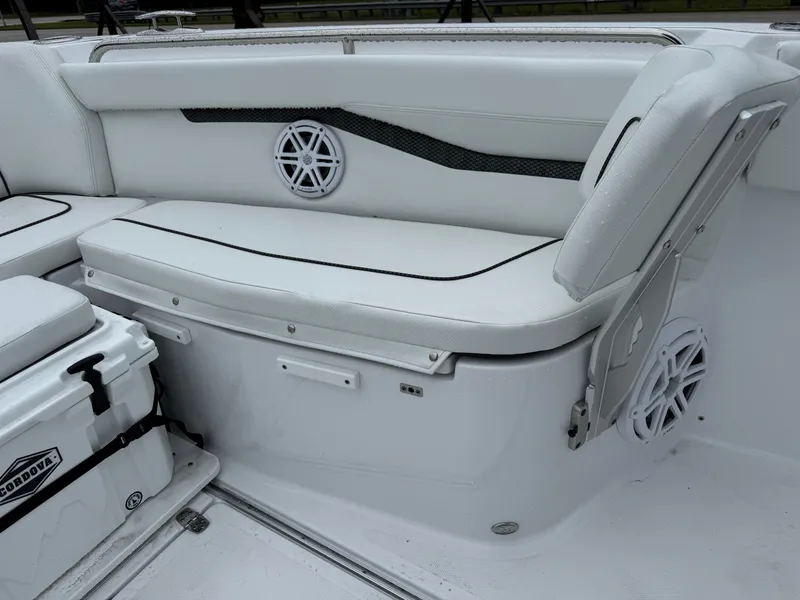 Slide: The Image of 2025 Wellcraft 263 Fisherman boat interior with white seating and storage. - 30