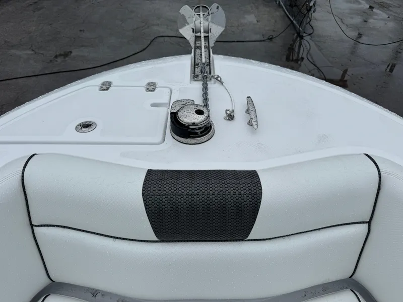 Slide: The Image of 2025 Wellcraft 263 Fisherman boat bow with anchor and seating detail. - 33