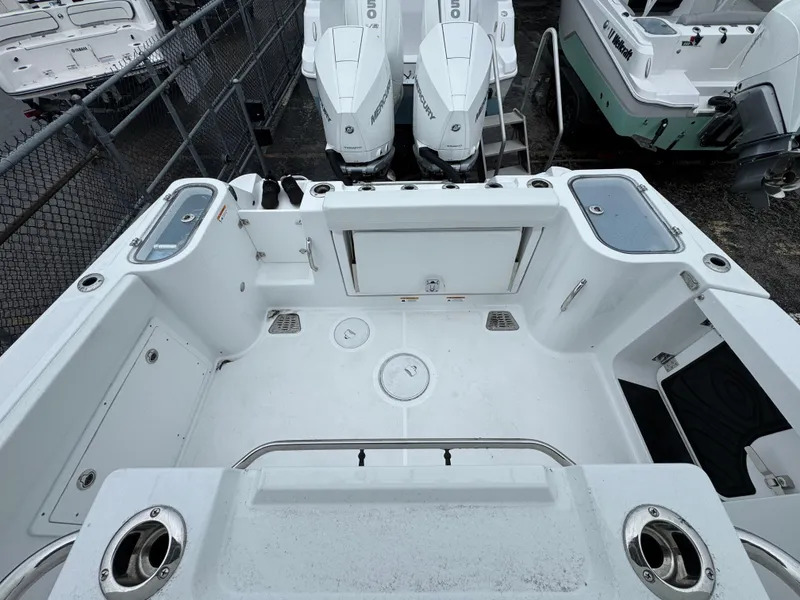 Slide: The Image of 2025 Wellcraft 263 Fisherman boat deck with dual outboard engines. - 7