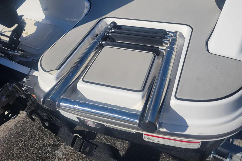 Slide: The Image of 2021 Tahoe T16 boat with a stainless steel swim ladder on the deck. - 10