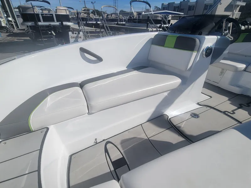 Slide: The Image of 2021 Tahoe T16 boat interior with white seating and modern design. - 12