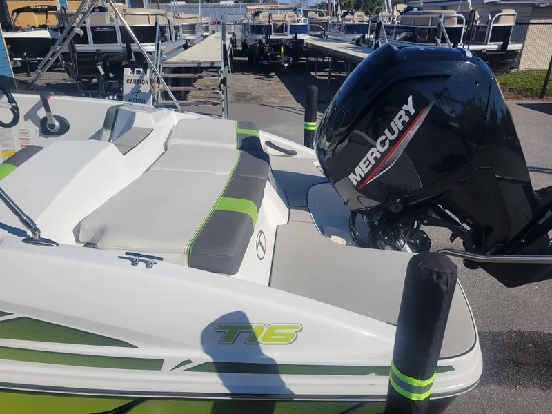Slide: The Image of 2021 Tahoe T16 boat with Mercury engine, docked at marina. - 4