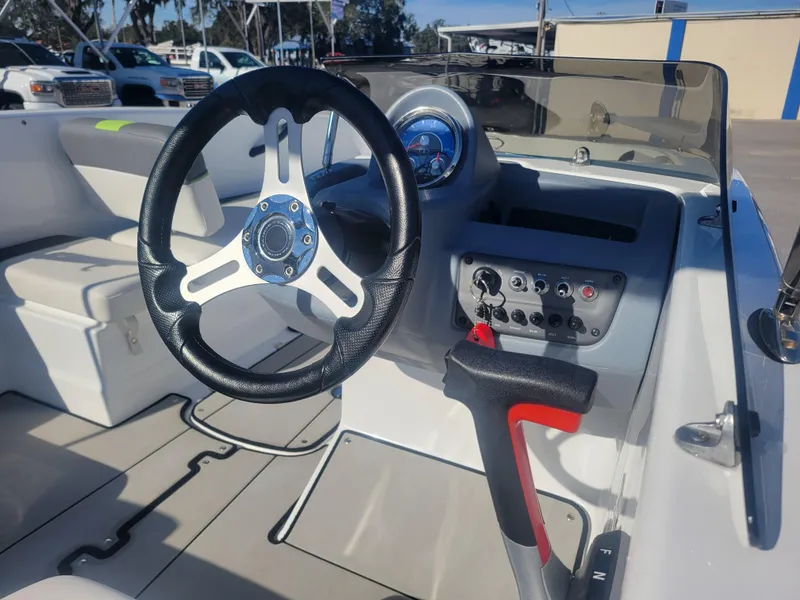Slide: The Image of 2021 Tahoe T16 boat interior with steering wheel and control panel. - 6