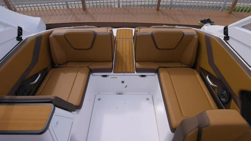 Slide: The Image of 2025 Yamaha Boats 252SD interior with tan seating and wood accents. - 10