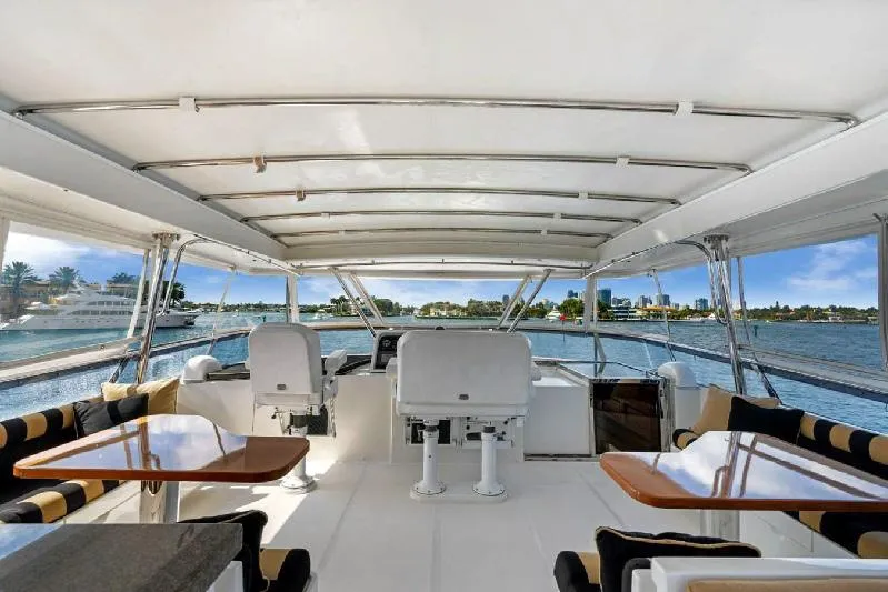 Slide: The Image of 2006 Paragon Cockpit Motoryacht interior with seating, tables, and ocean view. - 20