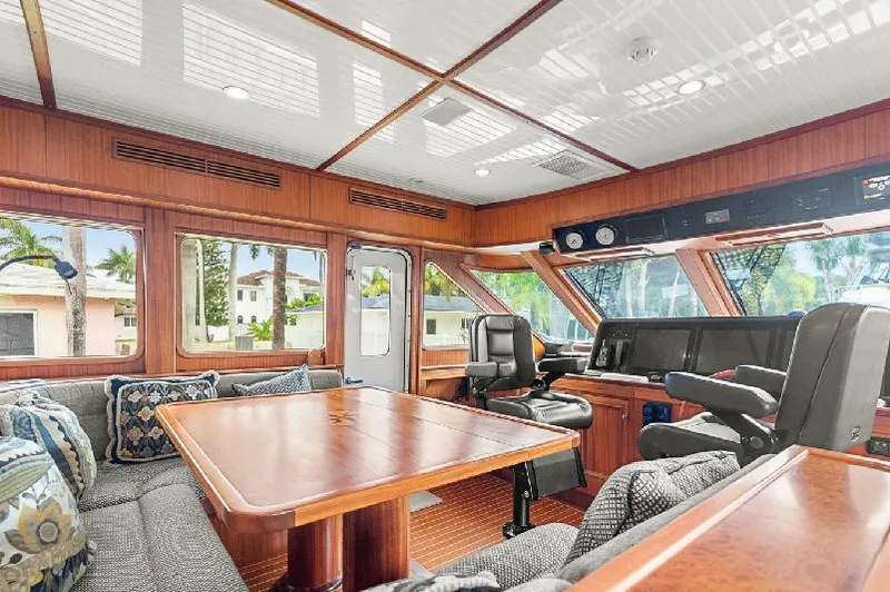 Slide: The Image of Luxurious interior of 2006 Paragon Cockpit Motoryacht with plush seating and elegant wood finishes. - 8