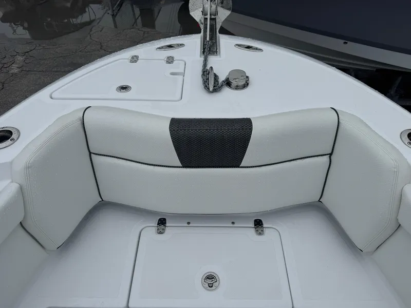 Slide: The Image of 2025 Wellcraft 263 Fisherman boat interior, featuring cushioned seating and deck details. - 19