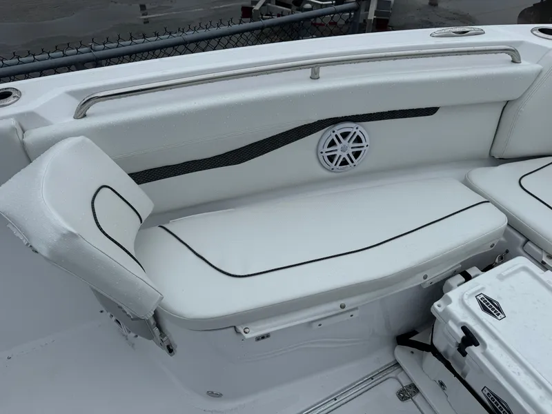 Slide: The Image of 2025 Wellcraft 263 Fisherman boat interior with white cushioned seating. - 26