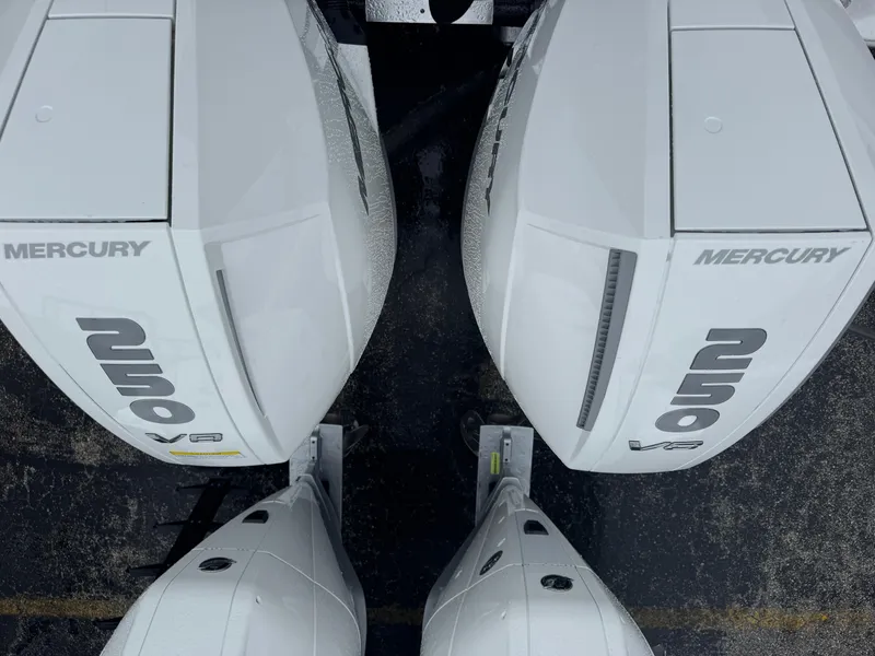 Slide: The Image of Twin Mercury outboard engines on a 2025 Wellcraft 263 Fisherman boat. - 3