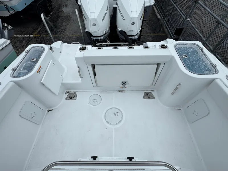 Slide: The Image of 2025 Wellcraft 263 Fisherman boat deck with dual outboard motors. - 30