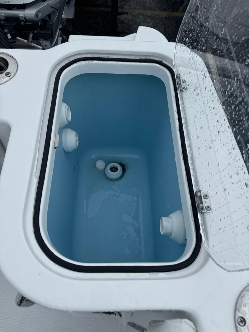 Slide: The Image of Livewell on 2025 Wellcraft 263 Fisherman boat, partially filled with water. - 33