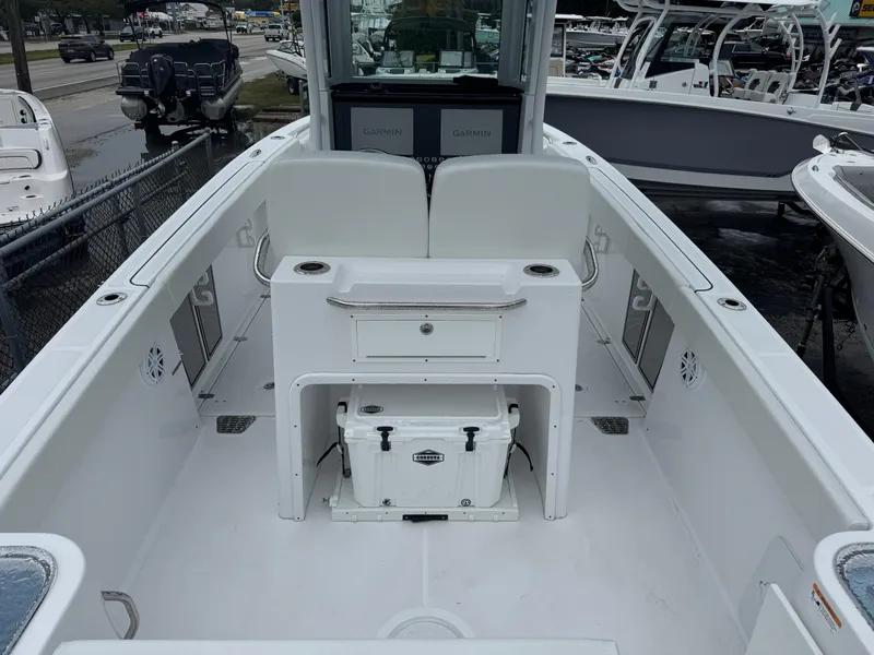 Slide: The Image of 2025 Wellcraft 263 Fisherman boat interior, featuring spacious seating and storage. - 5
