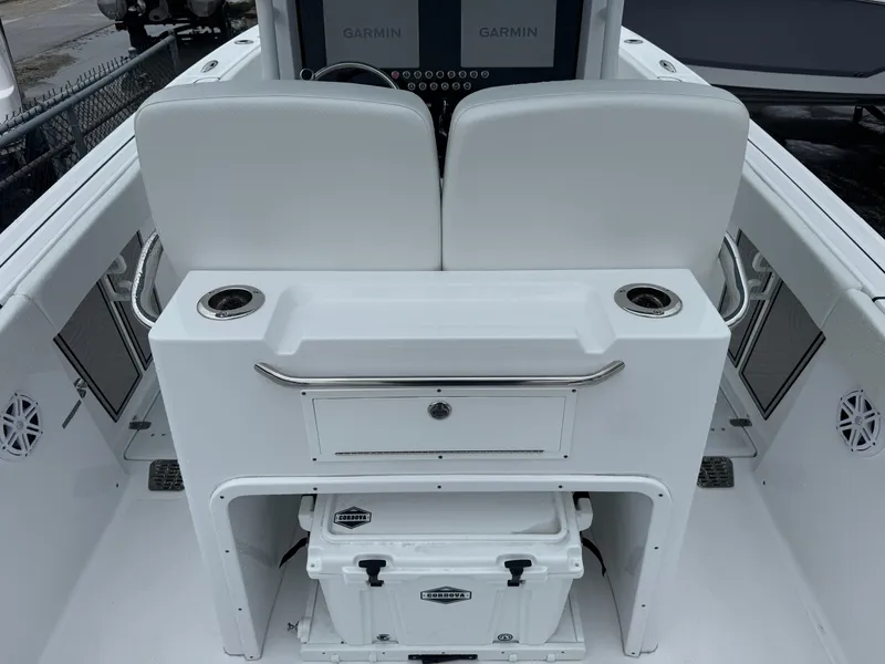 Slide: The Image of 2025 Wellcraft 263 Fisherman boat interior with dual seats and storage area. - 7