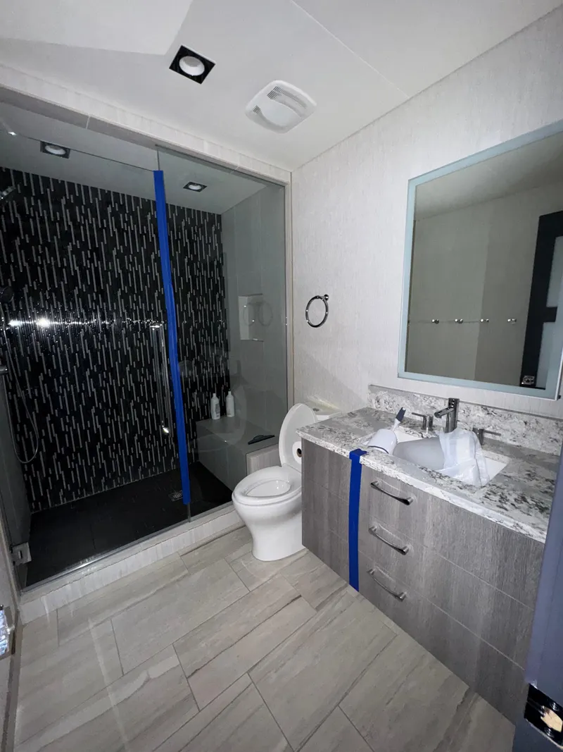 Slide: The Image of Modern bathroom in 2017 Adonia KSIX with glass shower and marble countertop. - 10