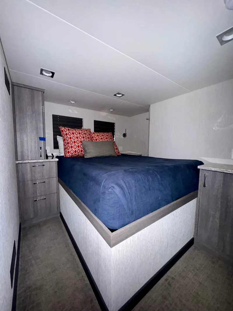 Slide: The Image of Interior of 2017 Adonia KSIX RV with cozy bed and modern decor. - 11