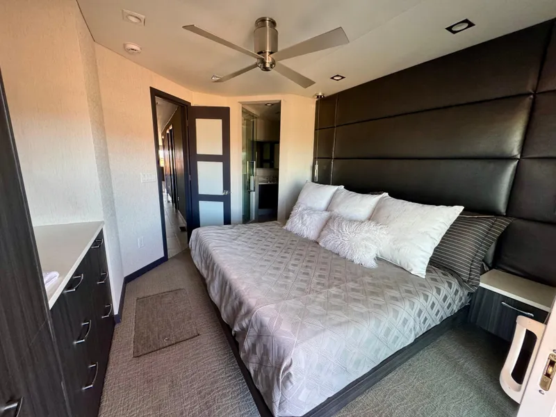 Slide: The Image of Modern bedroom in 2017 Adonia KSIX with king-size bed, ceiling fan, and sleek decor. - 13