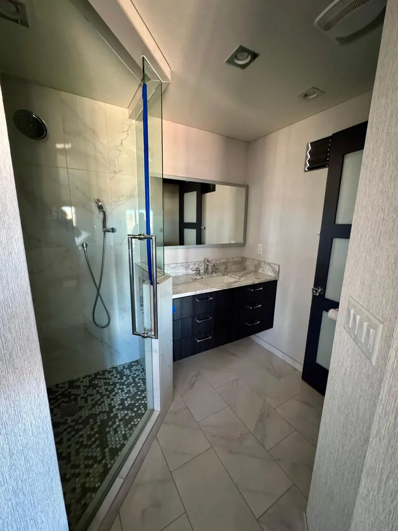 Slide: The Image of Modern bathroom in 2017 Adonia KSIX with glass shower and marble countertop. - 14