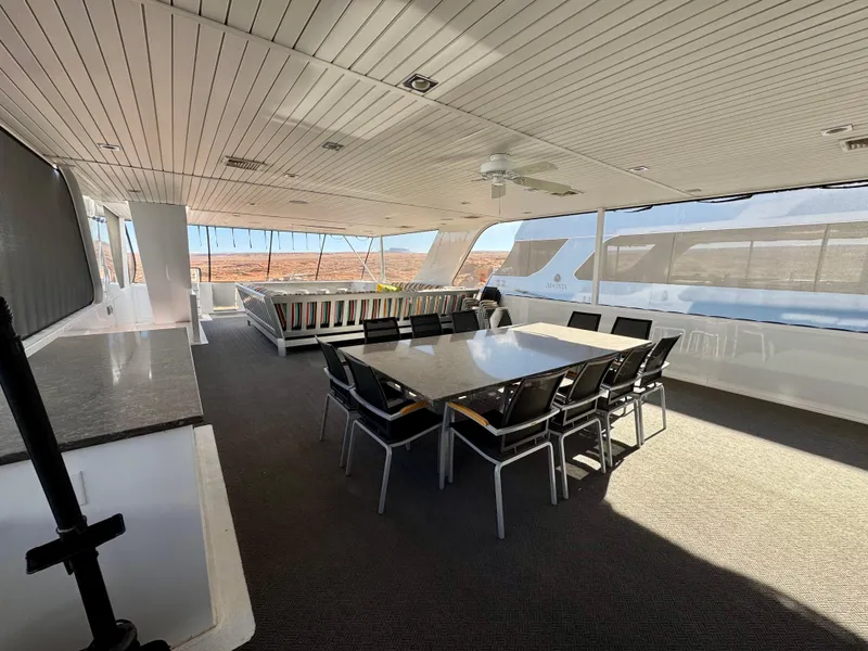 Slide: The Image of Spacious interior of 2017 Adonia KSIX yacht with dining area and panoramic windows. - 22