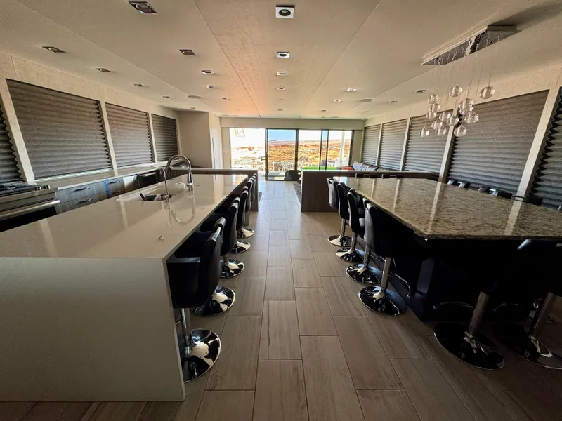 Slide: The Image of Luxurious 2017 Adonia KSIX interior with modern kitchen, sleek countertops, and elegant bar seating. - 3